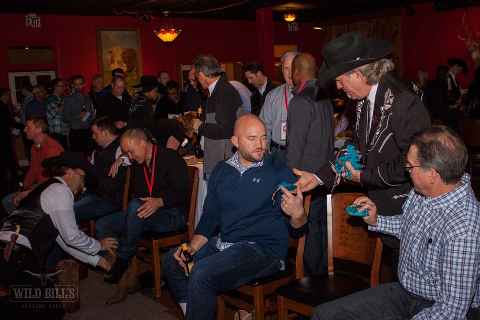 A group of people sitting in chairs at an event.