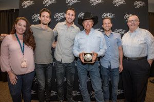 A group of people standing next to each other.