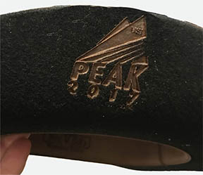 Guest receiving a one-on-one hat fitting